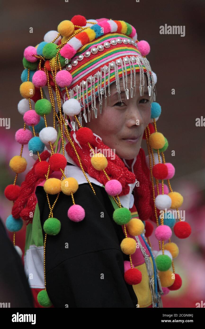 Woman in Lisu costume at village dance competition, Husa, Dehong Prefecture, southwest Yunnan, China 7th March 2008 Stock Photo