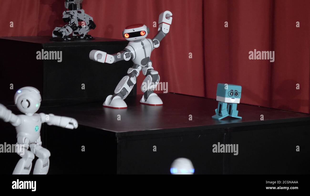 Toy robot dancing show. Modern technologies. Stock Photo