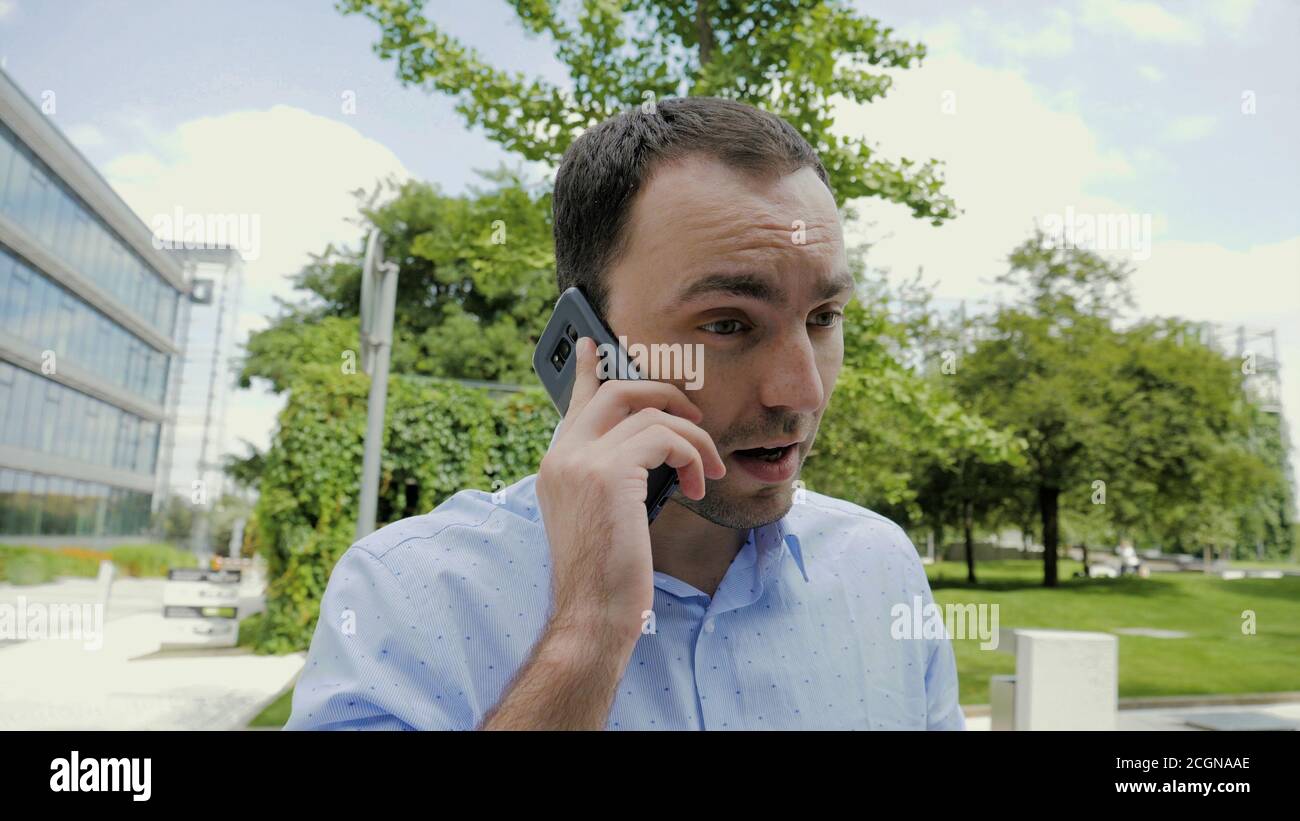 Businessman is having a difficult communication talking on the p Stock Photo