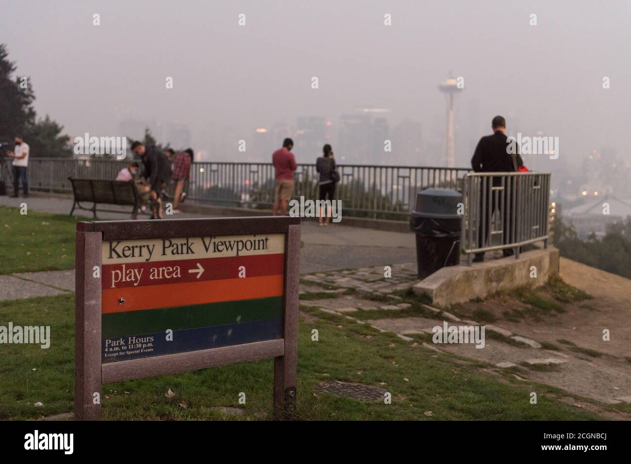 Seattle, USA. 11th Sep, 2020. People visiting the normally scenic Kerry Park, viewing the city skyline now blanketed with a plume of Wildfire smoke covering the Pacific Northwest. Seattleites are adjusting to a new normal of smokey summers. Wildfires rage yearly now causing a dramatic drop in air quality from the normally crisp clean Washington air. Credit: James Anderson/Alamy Live News Stock Photo