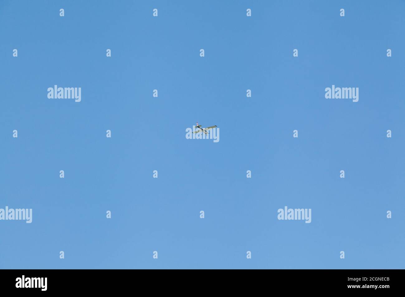 Light propeller driven airplane flying in blue sky Stock Photo - Alamy