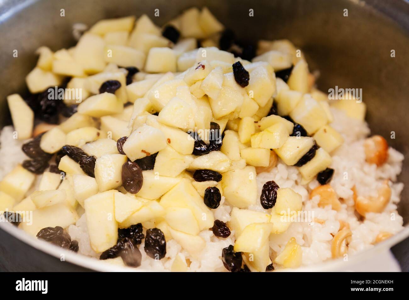 Sweet Rice And Raisin Cooking sweet rice with apples and raisins Stock Photo - Alamy