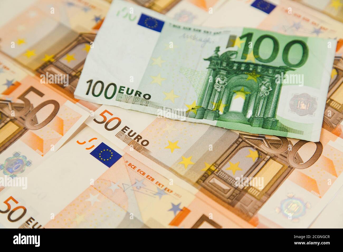 One hundred euro banknote on money background Stock Photo - Alamy