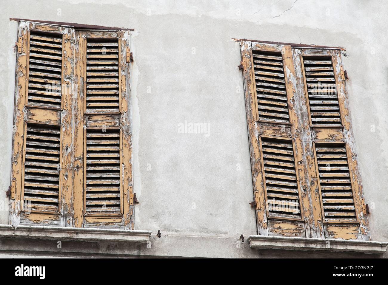 old closed wooden shutters with peeling paint Stock Photo - Alamy
