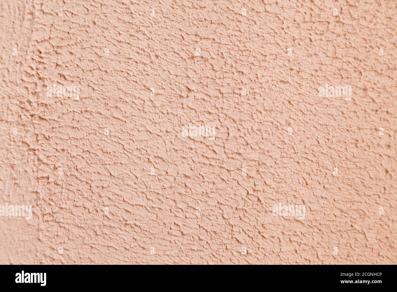 pink limestone textured wall background with selective focus Stock