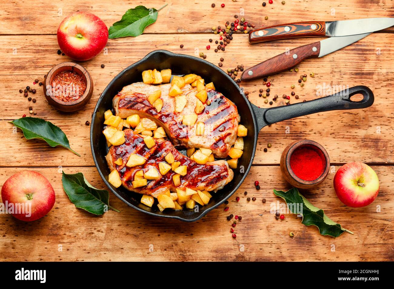 Fried meat steak with caramelized apple.Autumn food Stock Photo