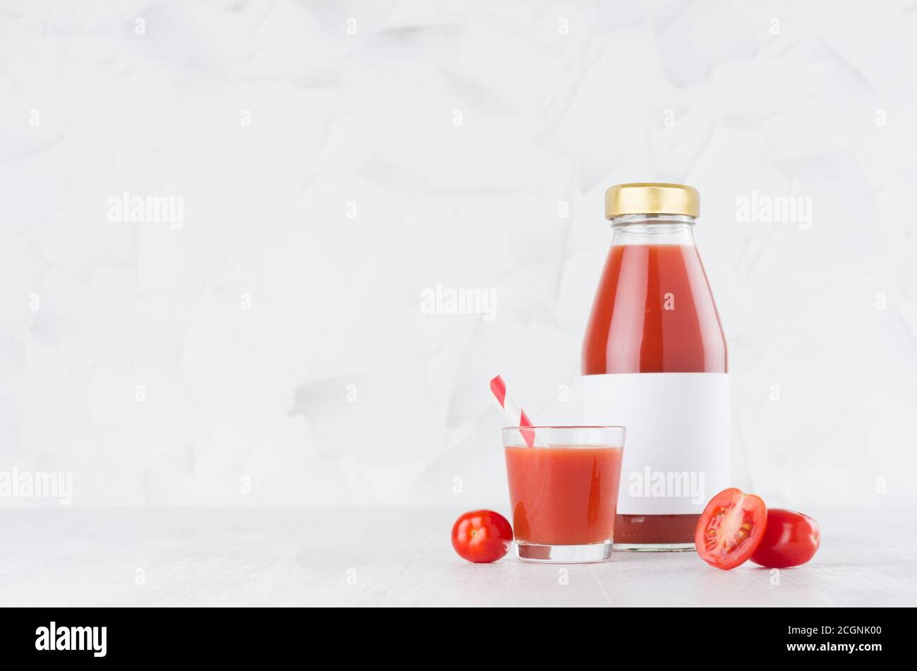 Download Fresh Red Tomato Juice In Glass Bottle With Blank Label Mock Up With Glass Straw Vegetables Slices In Soft Light White Interior On Wood Table With C Stock Photo Alamy