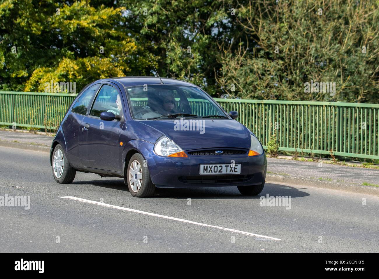 2002 blue Ford KA Collection; Vehicular traffic moving vehicles, cars driving vehicle on UK roads, motors, motoring on the M6 motorway highway network. Stock Photo