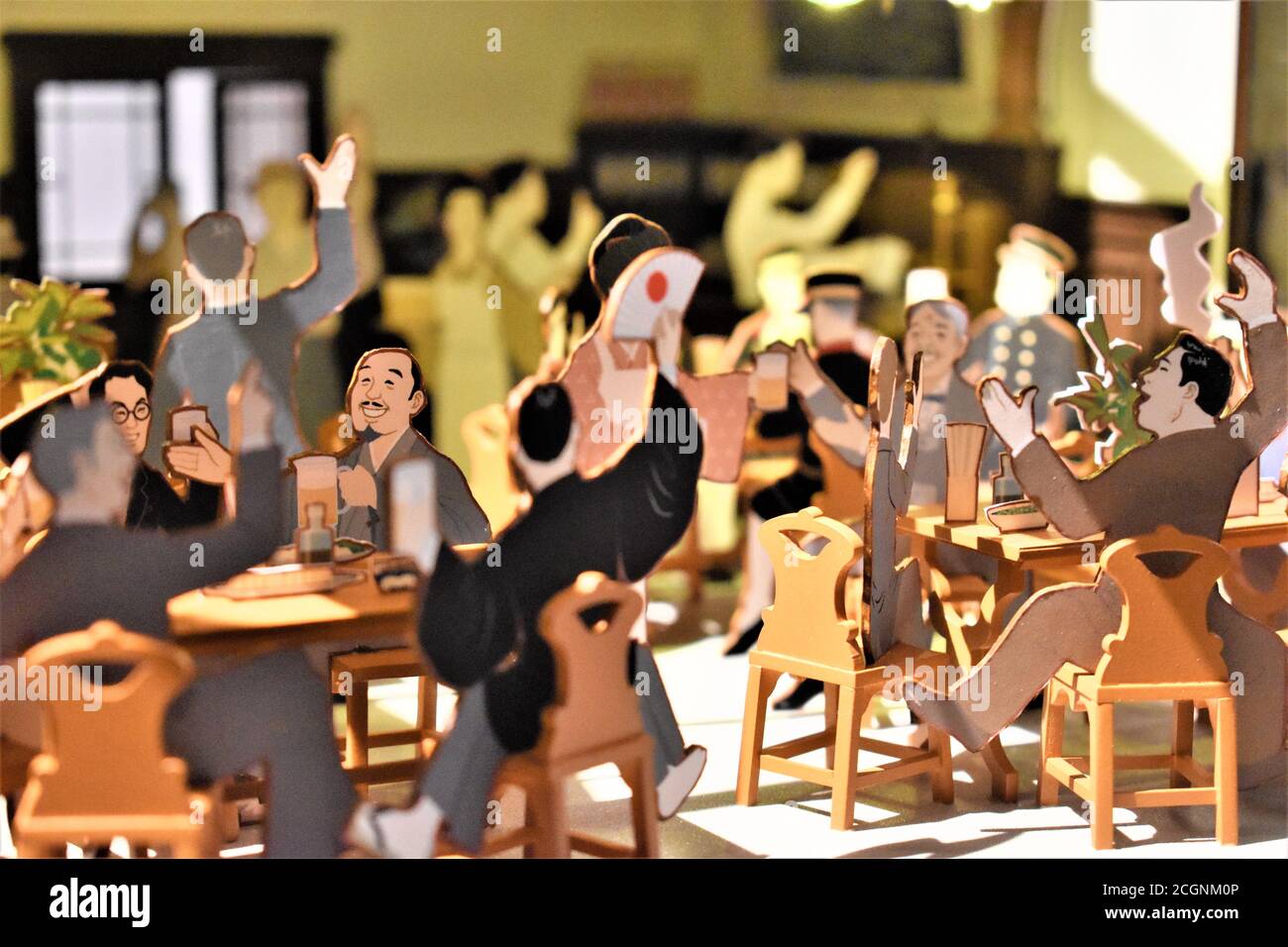 A diorama of Japanese men dining and having a good time during the pre-war period Stock Photo