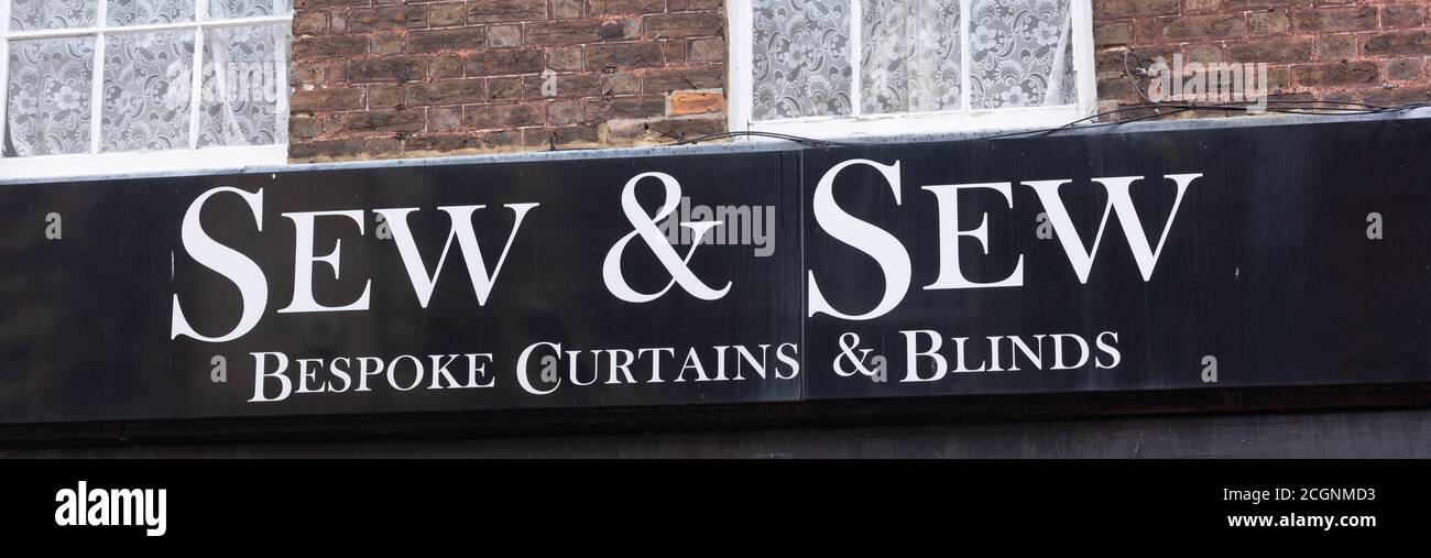 Abstract View of White Lettering and Black Background of Sew & Sew shop