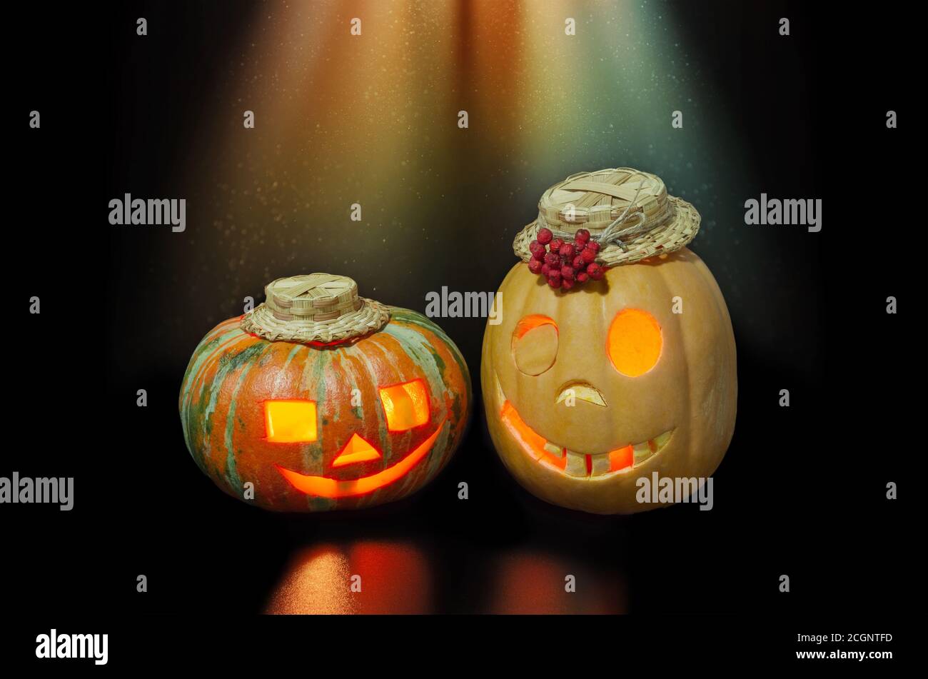 Halloween pumpkins in stage light on black background with copy space ...