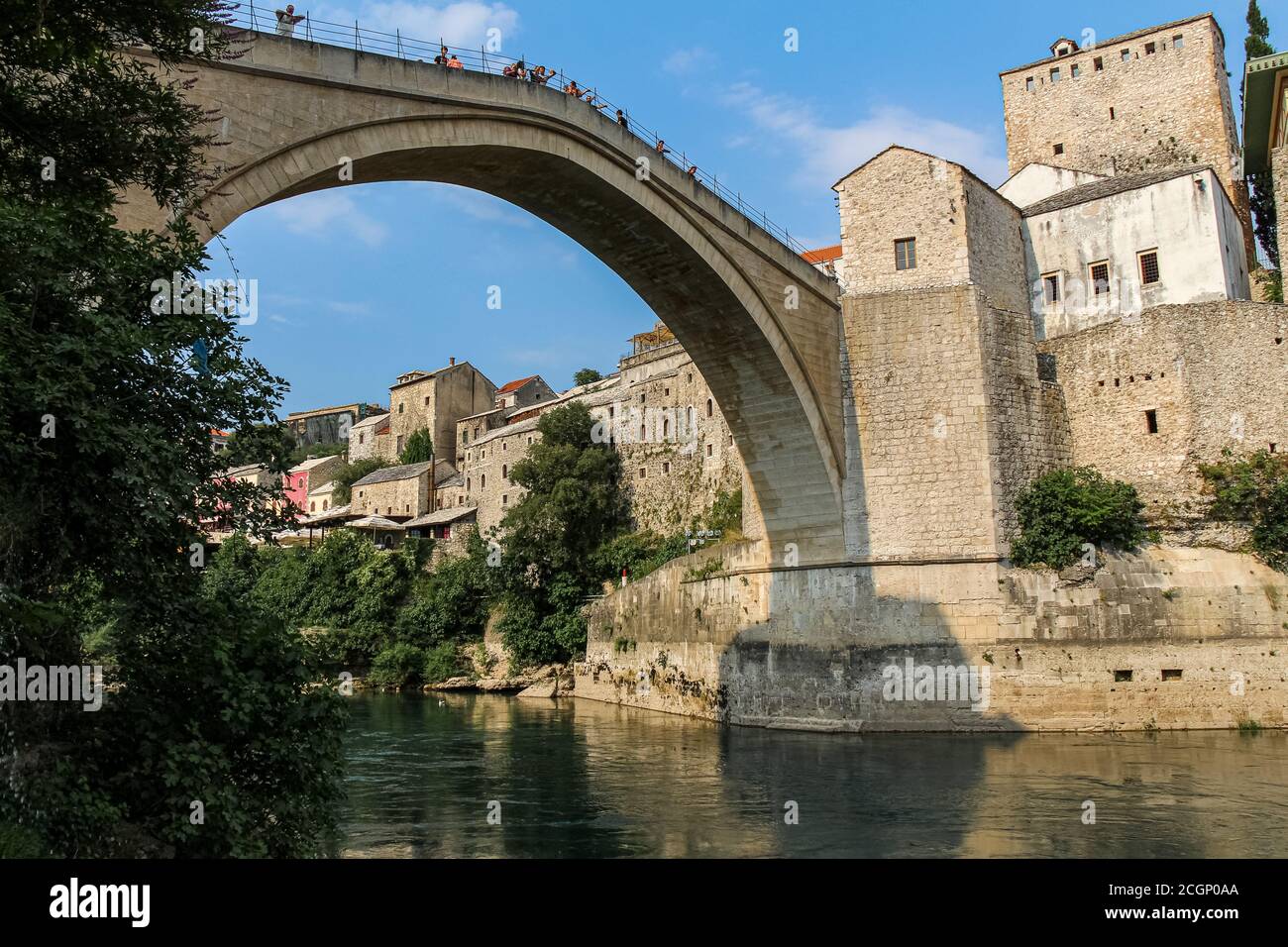 Mostar, Bosnia and Herzegovina - July 4th 2018: Close up of the historic arched Old Bridge of Mostar on the Neretva River, in the old town of Mostar, Stock Photo