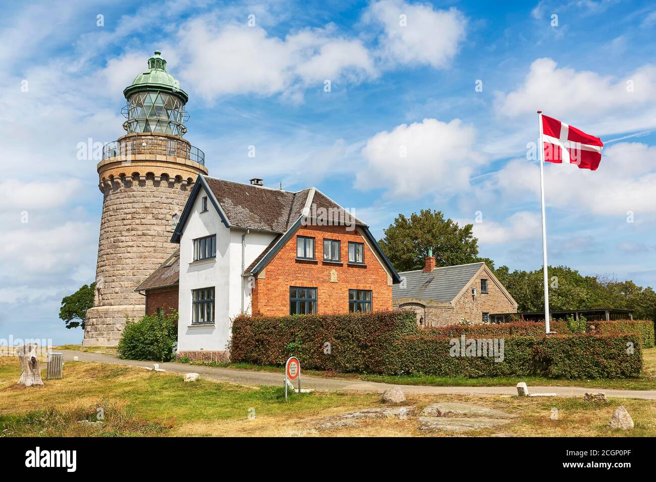 Lighthouse Hammeren Fyr, Danish flag, Allinge, Bornholm, Denmark Stock Photo