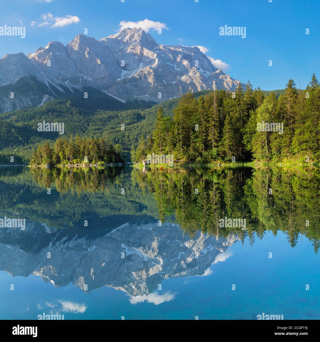 Zugspitze is reflected in lake eibsee hi-res stock photography and ...