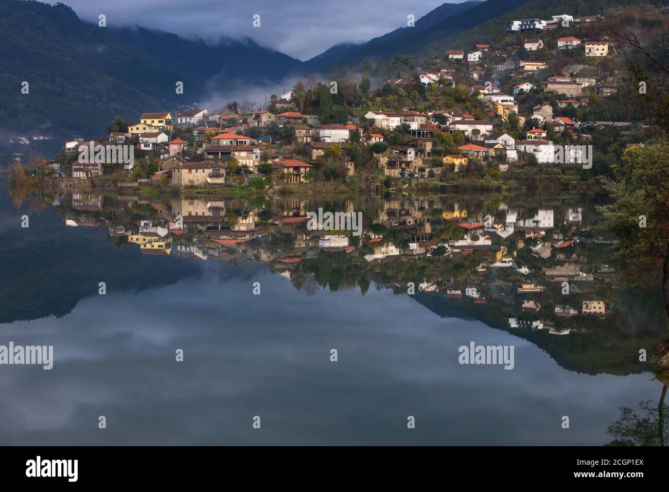 Village of Vilar da Veiga with little patches of fog and beautiful water reflections in Peneda Geres National Park, Portugal Stock Photo