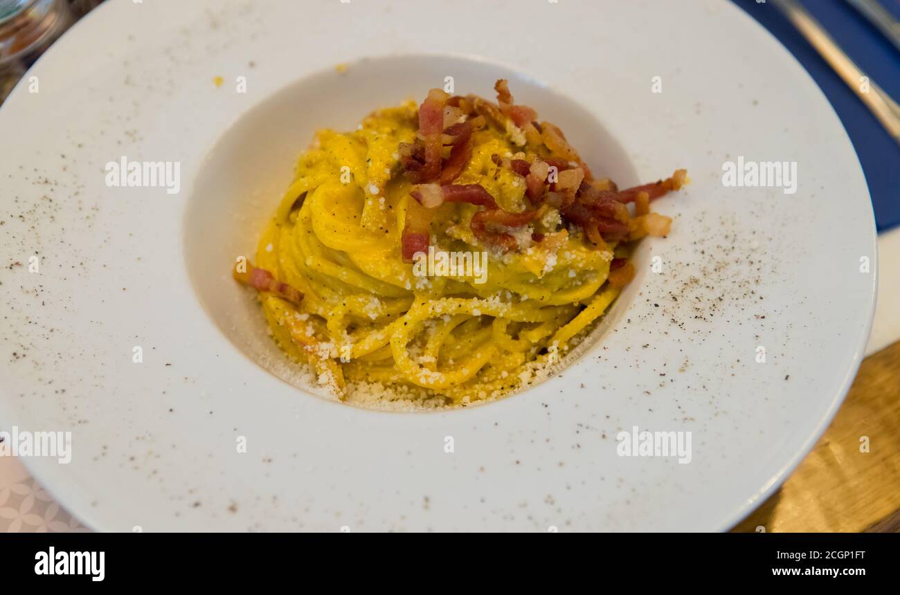 Spaghetti alla carbonara ready to eat. It is a traditional italian pasta dish Stock Photo