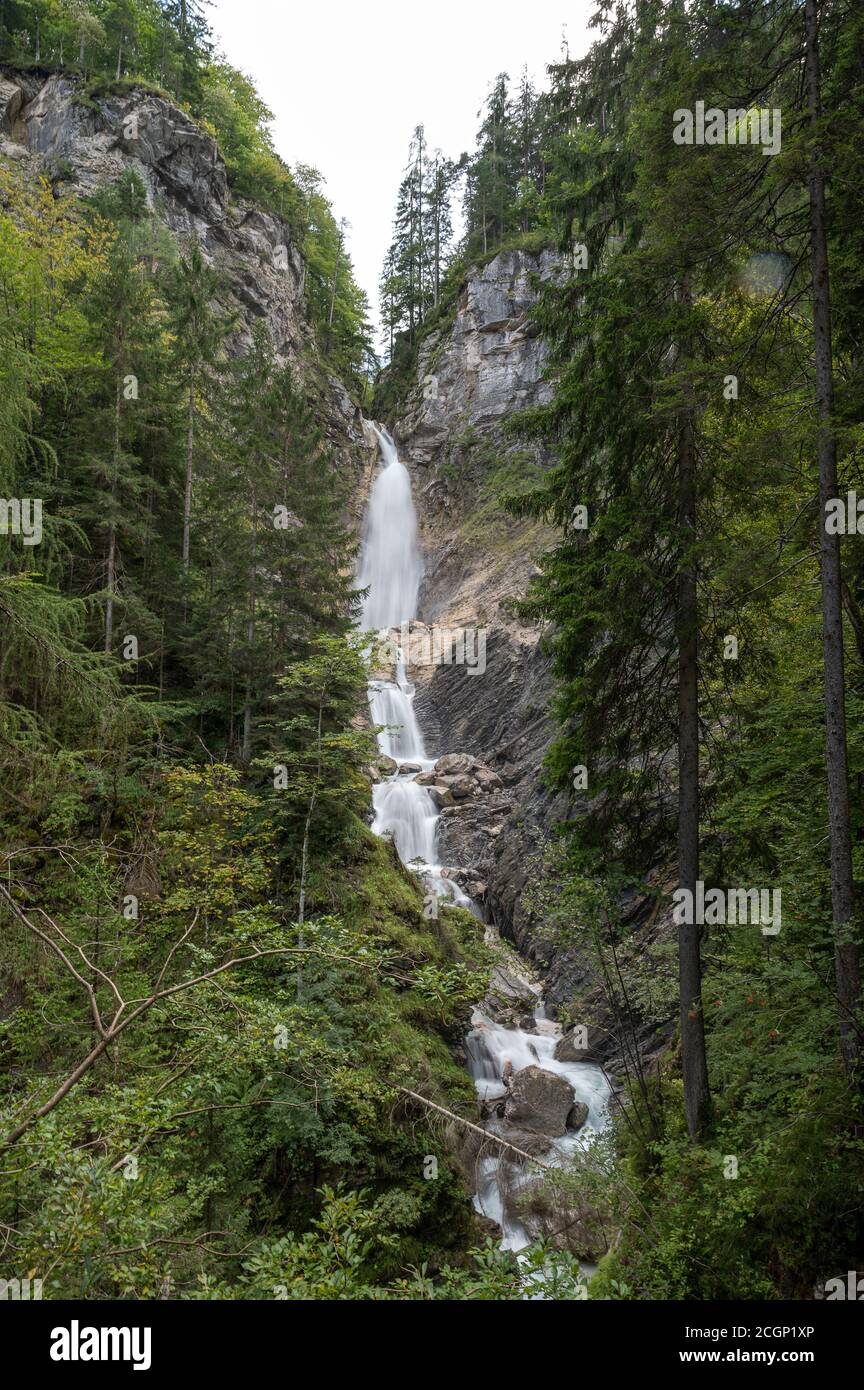 Long exposure image of beautiful waterfall falling down the rocks ...