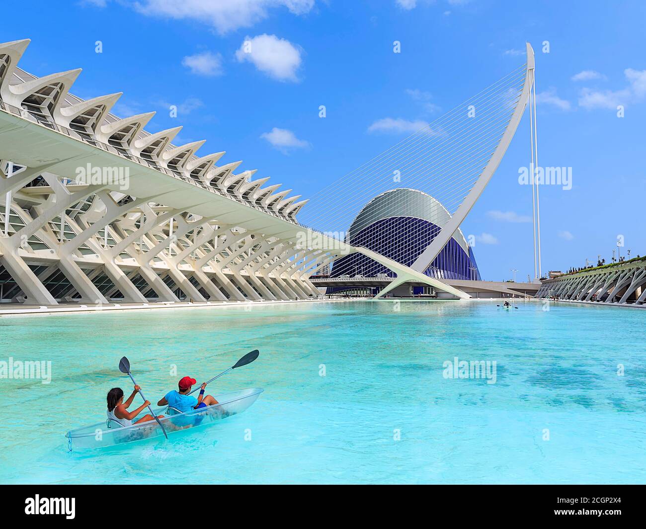 Principe Felipe Science Museum and Puente de l'Assut de l'Or bridge, architect Santiago Calatrava, couple in transparent kayak, Ciudad de las Artes y Stock Photo