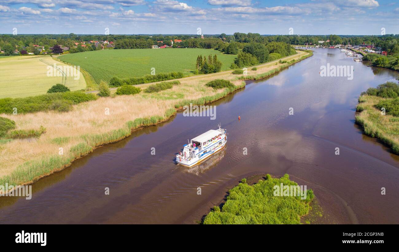 Aerial view, excursion boat on Barsseler Tief, River Leda, Barssel, Oldenburger Muensterland, Lower Saxony, Germany Stock Photo
