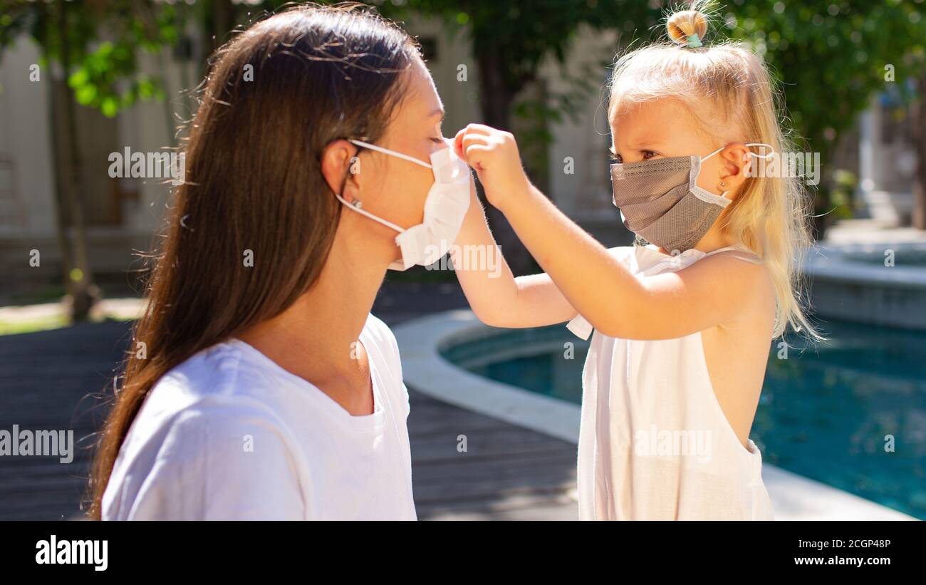 The girl puts on a mask hi-res stock photography and images - Alamy