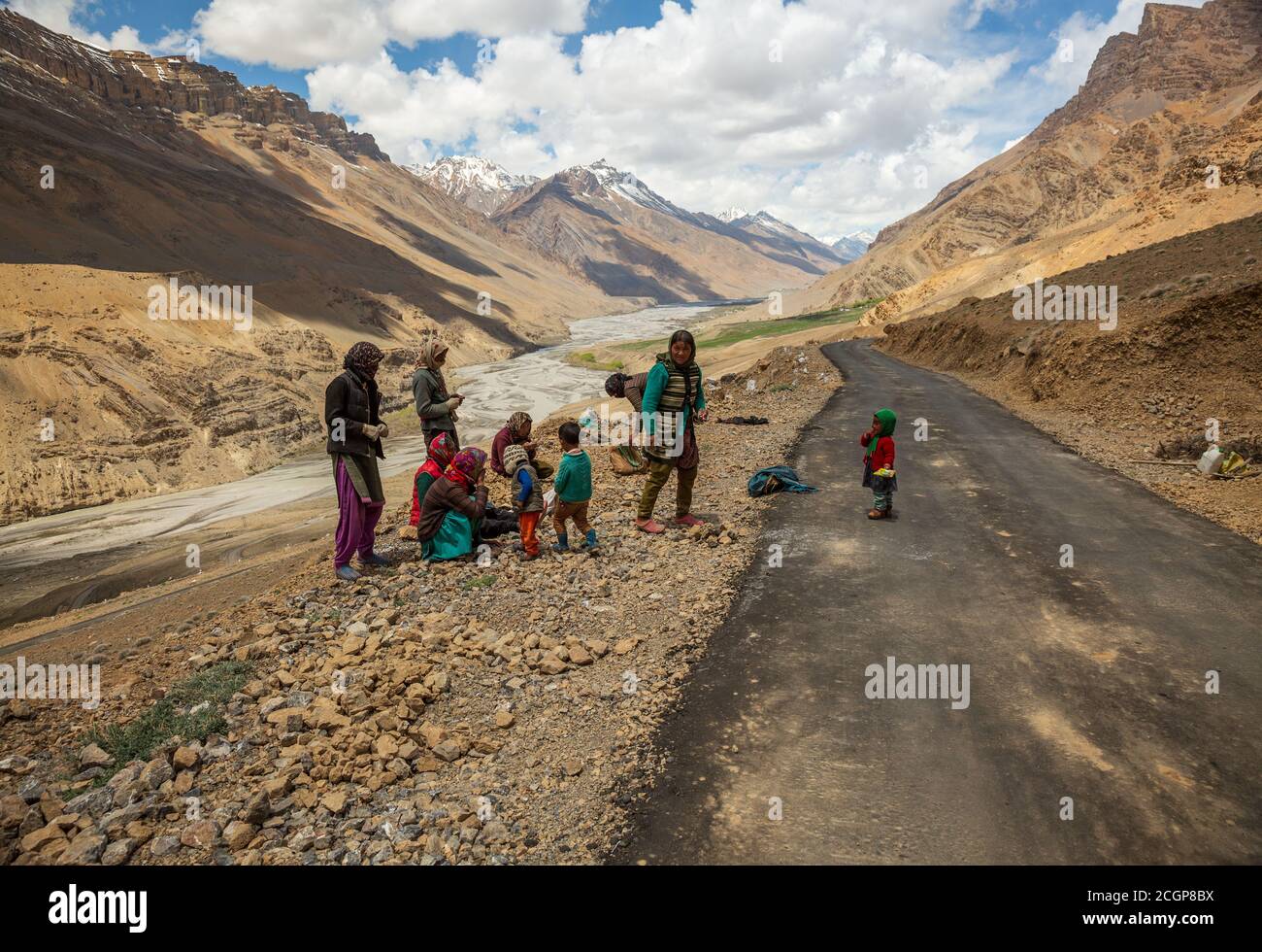 Working people at road construction site in high altitudes of trans himalayan mountain range in Spiti valley, Himachal Pradesh, India Stock Photo