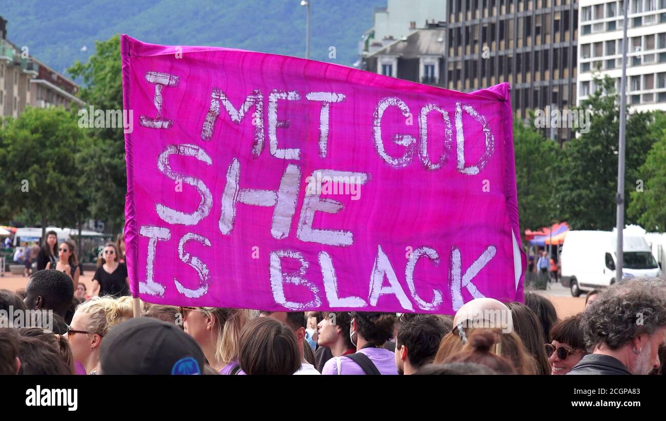 I met God she is black feminist and antiracist slogan brandished at the feminist strike Stock Photo