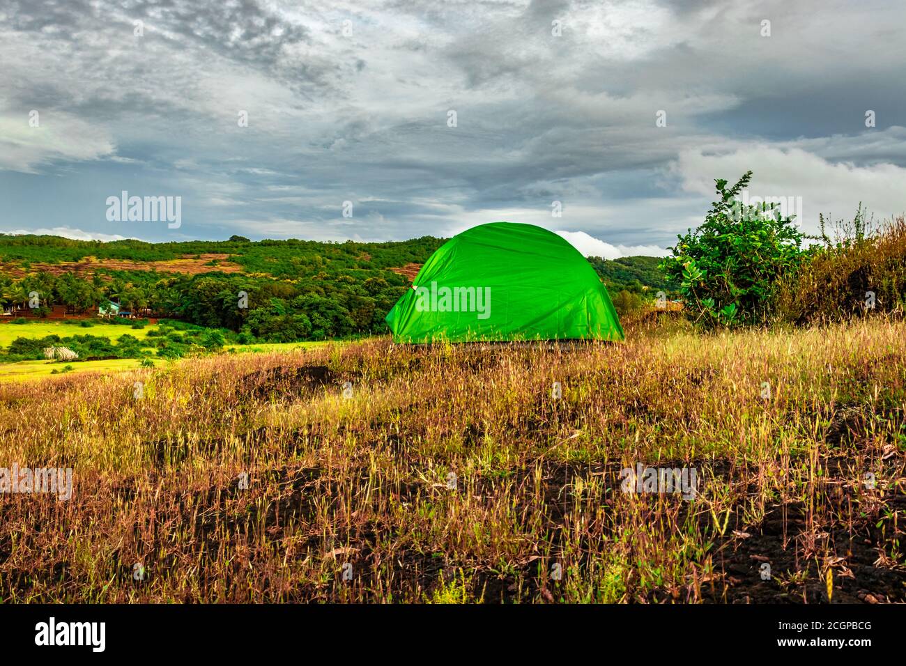 camping solo at mountain top with clouded sky image is taken at gokarna karnataka india. Stock Photo