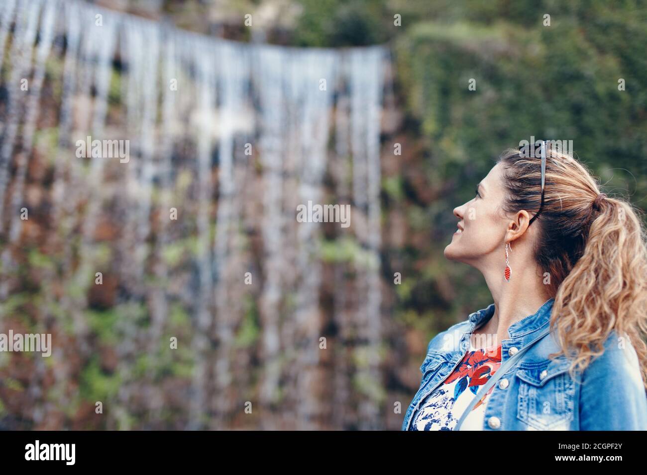 Young Caucasian woman wondering in waterfall, Budapest, Hungary Stock Photo