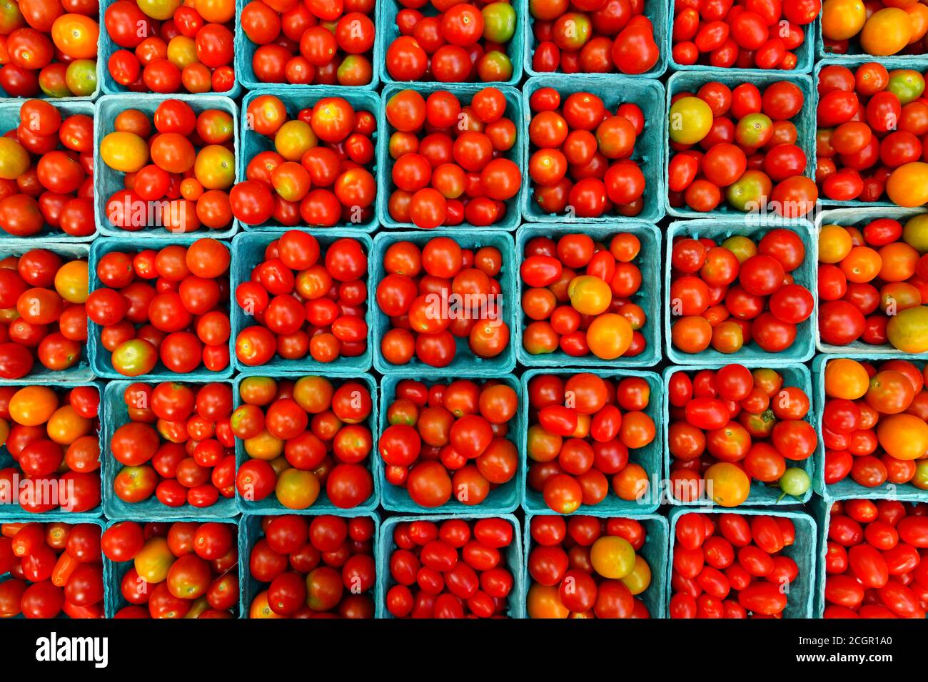 Containers of colorful tomatoes at the farmers market Stock Photo - Alamy