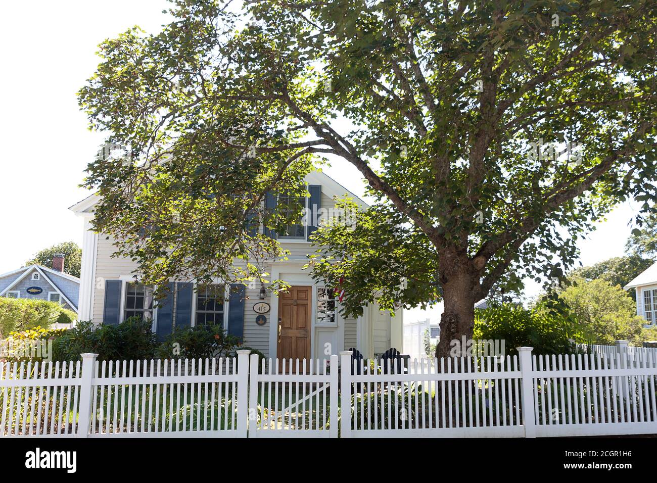 White picket fence house in Chatham, Massachusetts, United States. Stock Photo