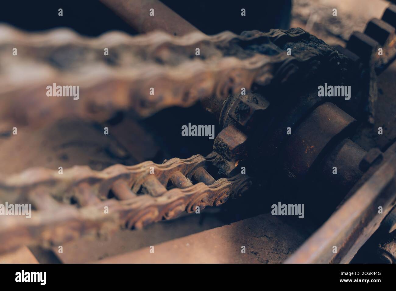Close up chains that are part of a machine are old and dirty and stain ...