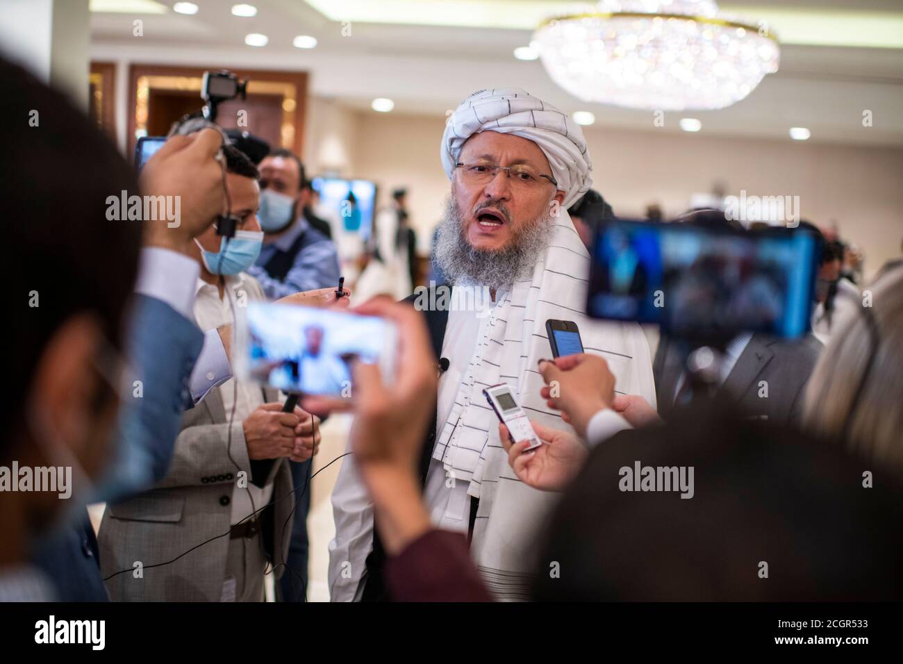 12 September 2020, Qatar, Doha: Abdul Salam Hanafi, member of the Taliban negotiating team, speaks to journalists at the start of the intra-Afghan peace talks. Photo: Arne Immanuel Bänsch/dpa Stock Photo