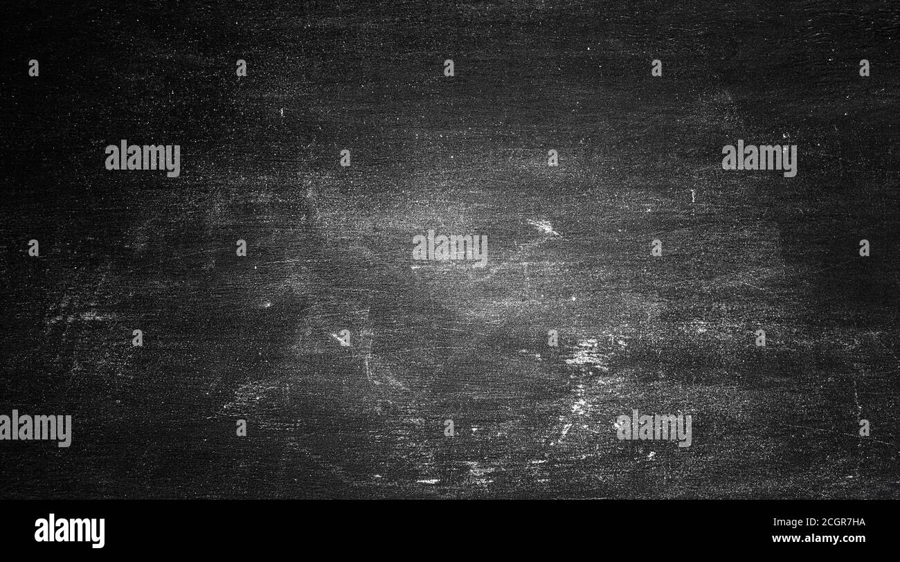 Abstract black background with white spots on old shabby black surface