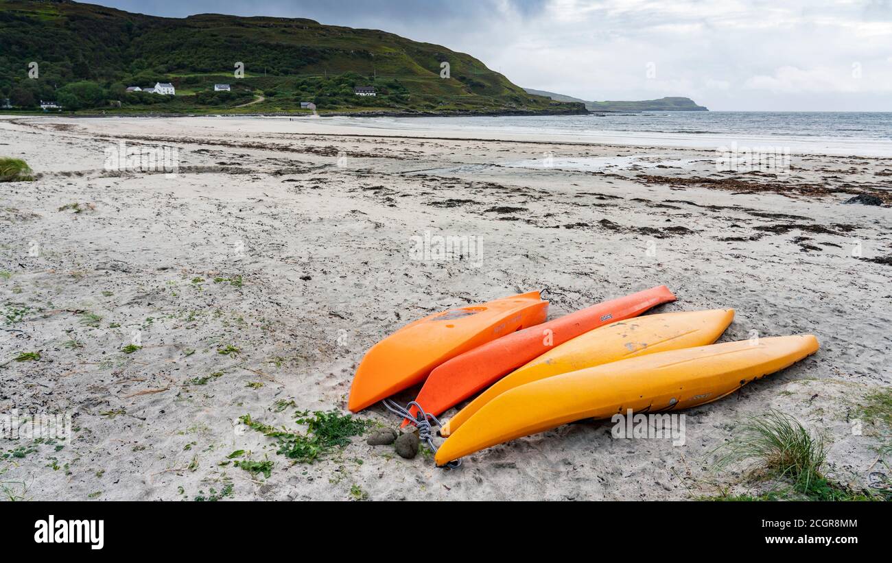 Orange kayaks on beach at Calgary on island of Mull, Argyll and Bute, Scotland, UK Stock Photo