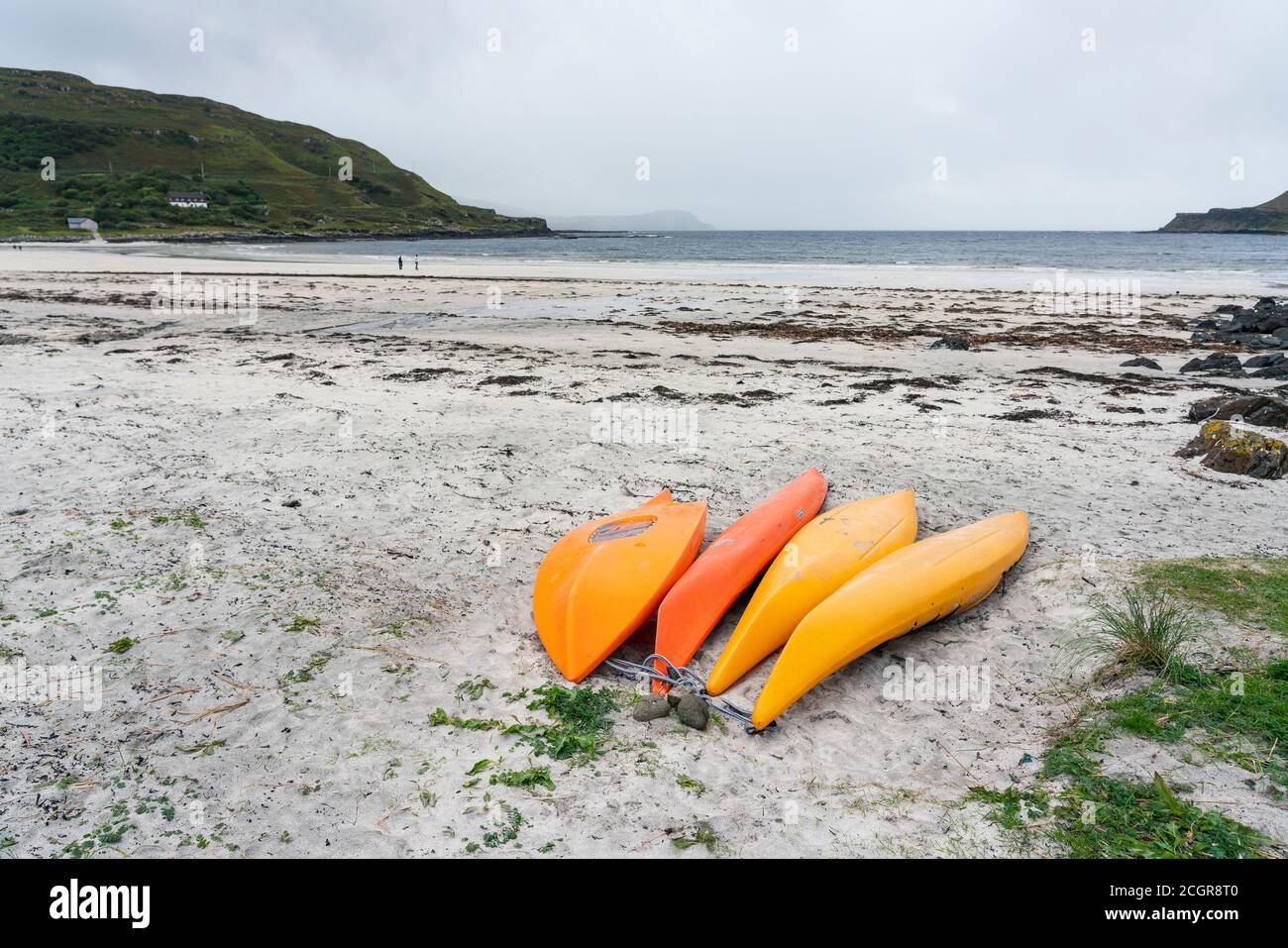 Orange kayaks on beach at Calgary on island of Mull, Argyll and Bute, Scotland, UK Stock Photo