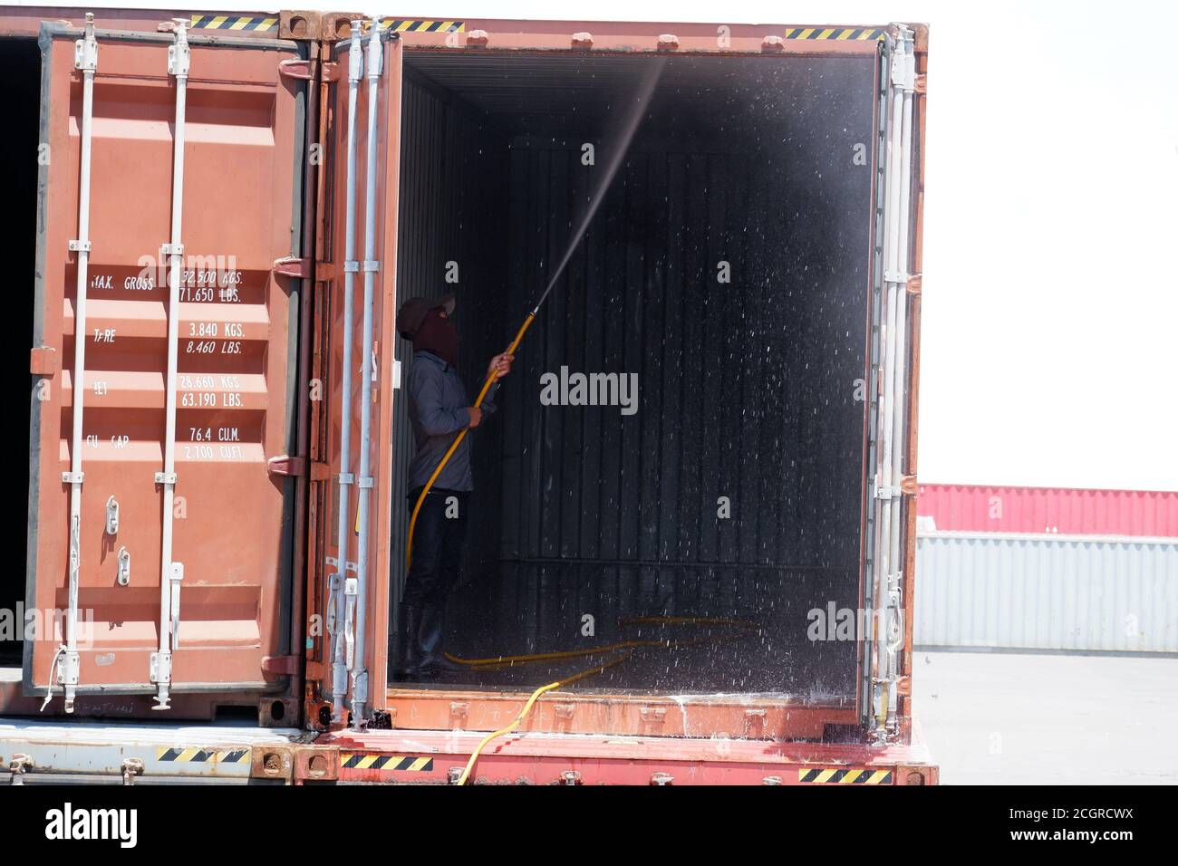 Employees are cleaning the containers Stock Photo Alamy