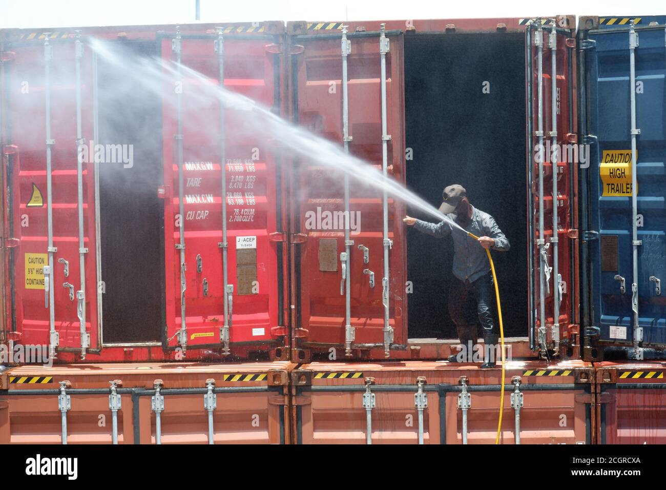 Employees are cleaning the containers. Stock Photo