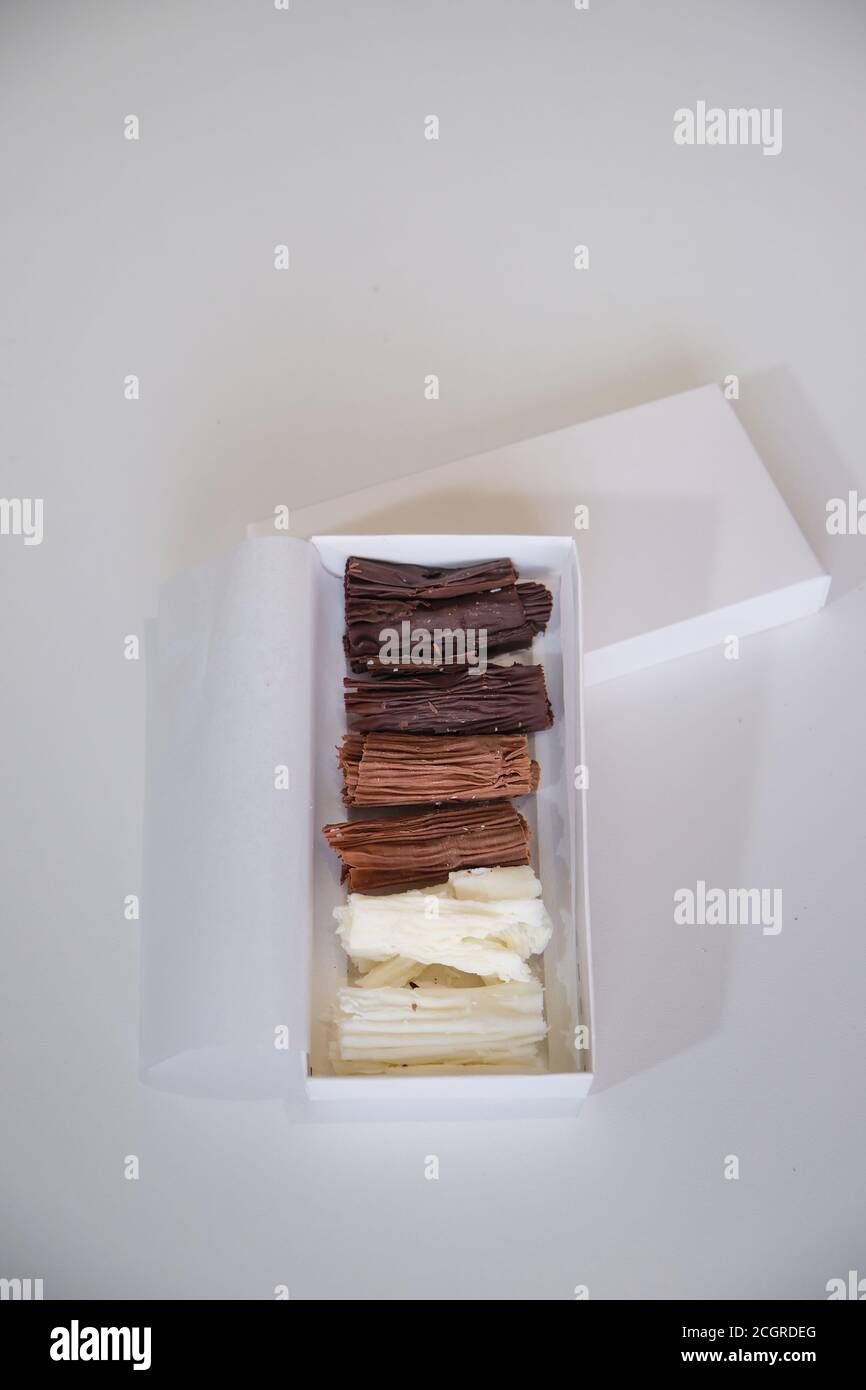 chocolate rolls. chocolate firewood. homemade dark, white and milk chocolate sticks Stock Photo