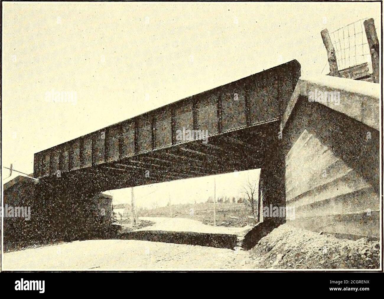 . The Street railway journal . HIGHWAY BRIDGE AT ARDMORE AVENUE, SHOWING ALSO THE DOUBLE-POLE CONSTRUCTION AT CROSSINGS WITH FOREIGN WIRES of which a considerable proportion is disintegrating mica.The company is sowing alfalfa on all of its fills to securea good binder and enhance the appearance of the right ofway, in favorable contrast to the cinder-covered roadwayof steam railroads. The largest cut is 500 ft. west of the power station.It is 600 ft. long and has a maximum depth of 40 ft, and required the removal of 20,000 cu. yds. of granite. Thebiggest fill is located over the old Conestoga Stock Photo