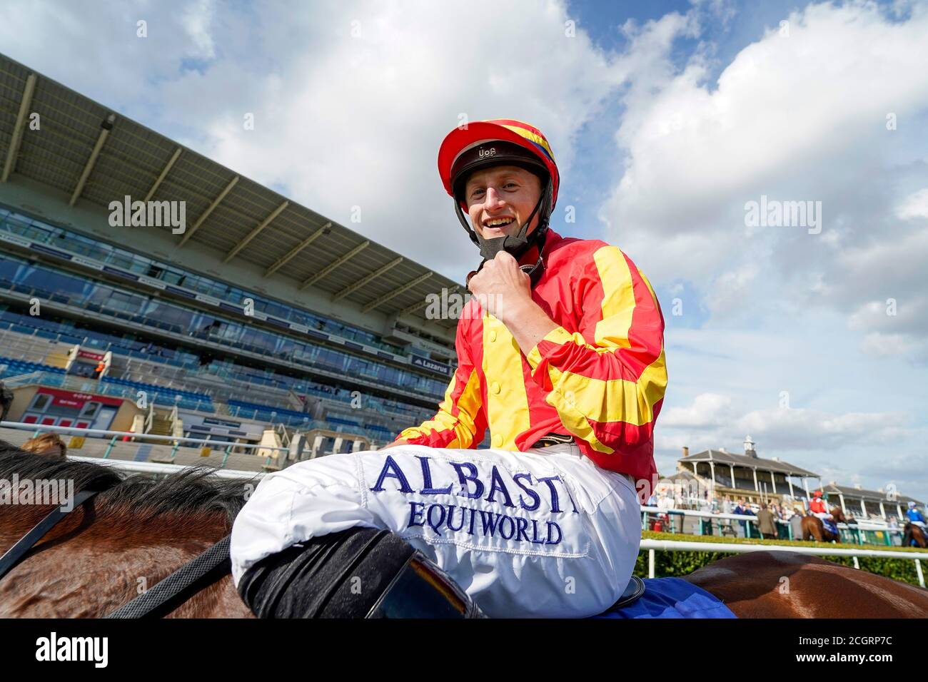 Jockey Tom Marquand celebrates winning The Pertemps St Leger Stakes race during day four of the William Hill St Leger Festival at Doncaster Racecourse. Stock Photo