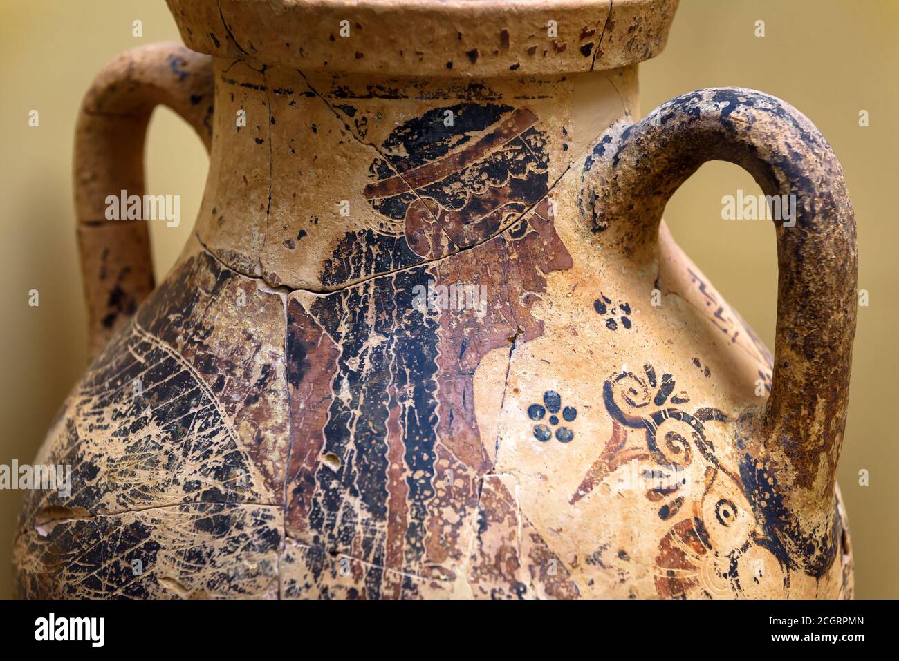 Vase from excavations in Mycenae, Greece. Painted archeological pottery, remains of Ancient Greek culture. Human image on terracotta ceramic, old Gree Stock Photo