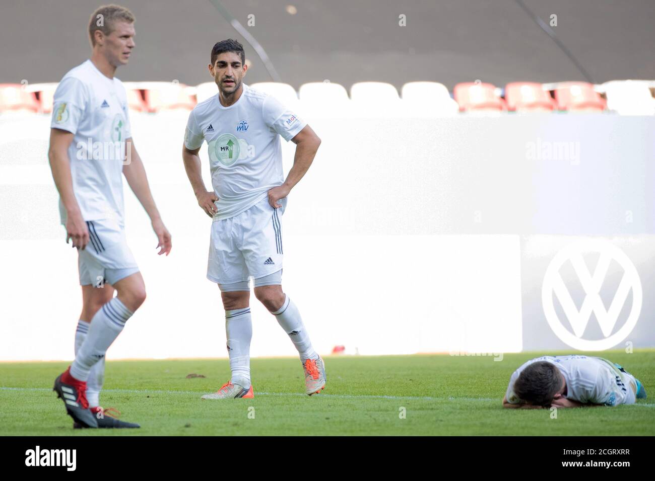 Augsburg, Germany. 12th Sep, 2020. Football: DFB Cup, Eintracht Celle - FC Augsburg, 1st round, WWK Arena. Celles Malte Marquardt (l-r), Celles Gerbi Kaplan and Celles Tim-Yannick Struwe react in the game. Credit: Tom Weller/dpa - IMPORTANT NOTE: In accordance with the regulations of the DFL Deutsche Fußball Liga and the DFB Deutscher Fußball-Bund, it is prohibited to exploit or have exploited in the stadium and/or from the game taken photographs in the form of sequence images and/or video-like photo series./dpa/Alamy Live News Stock Photo