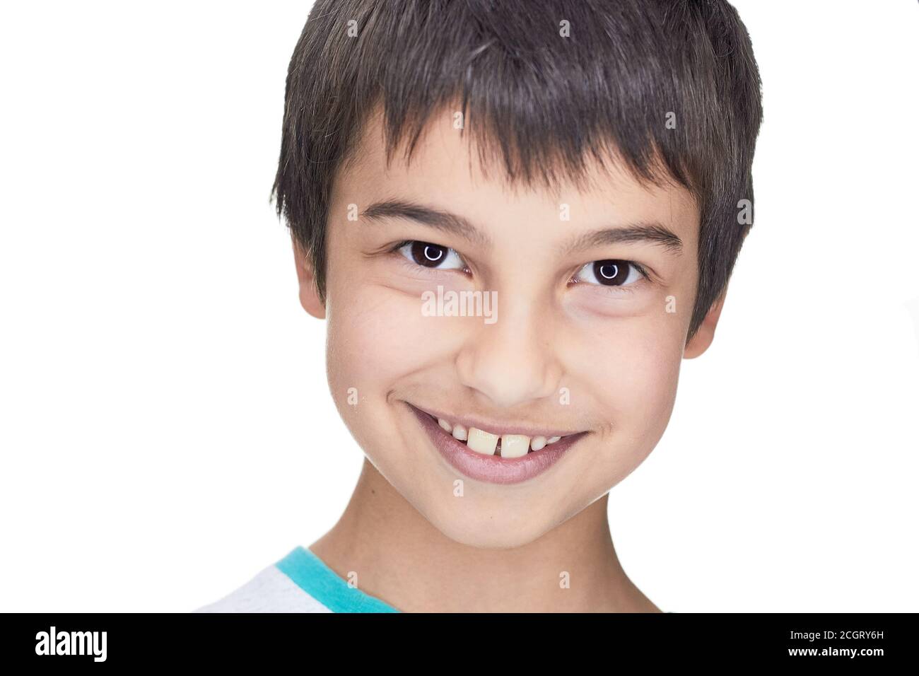 a dark haired handsome boy with dark eyes a dazzling smile Stock Photo