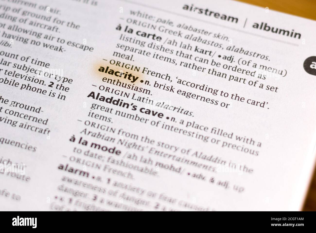 The word or phrase Alacrity in a dictionary highlighted with marker. Stock Photo