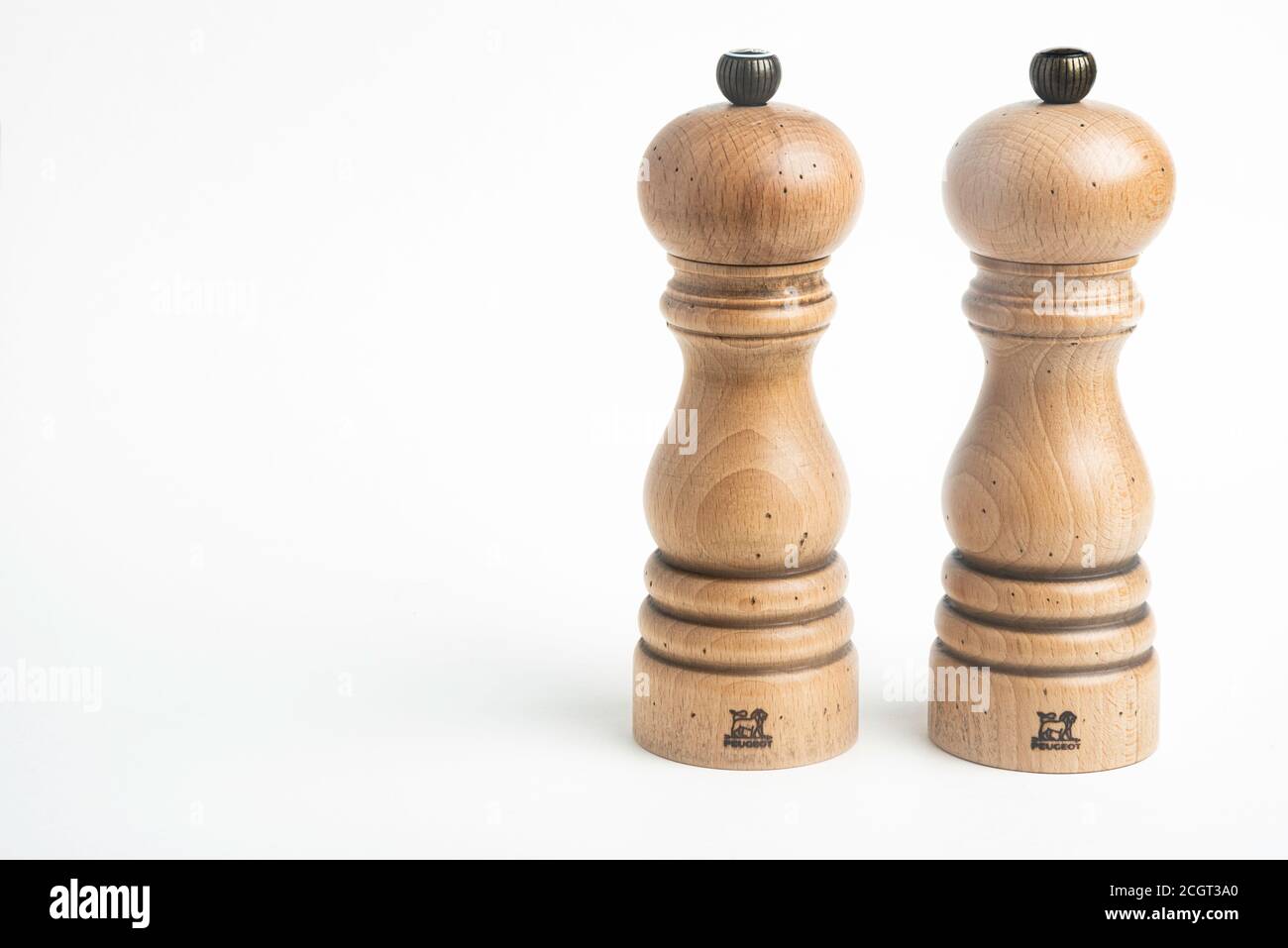 Vidalia, Georgia / USA - May 5, 2020: A medium-size iconic Paris model of the Peugeot pepper and salt mill set in natural wood with metal jewel knob. Stock Photo