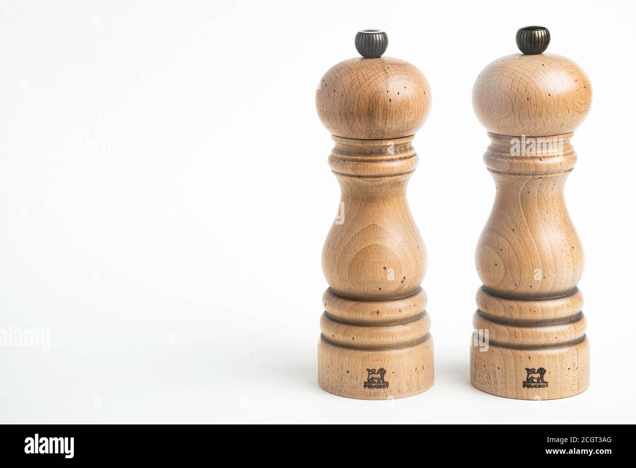 Vidalia, Georgia / USA - May 5, 2020: A medium-size iconic Paris model of the Peugeot pepper and salt mill set in natural wood with metal jewel knob. Stock Photo
