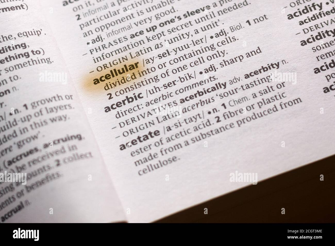 The word or phrase Acellular in a dictionary highlighted with marker. Stock Photo