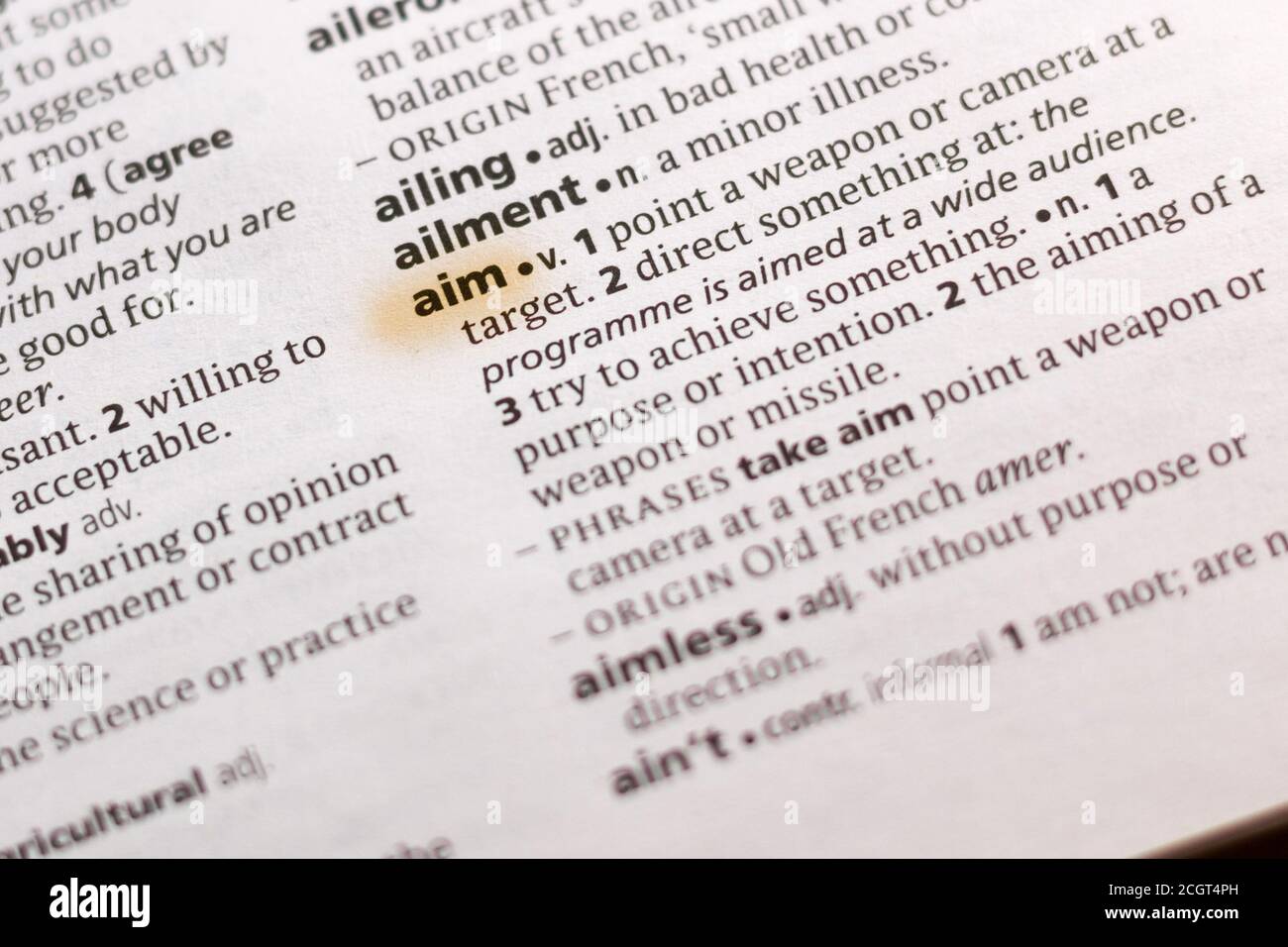 The word or phrase Aim in a dictionary highlighted with marker Stock ...
