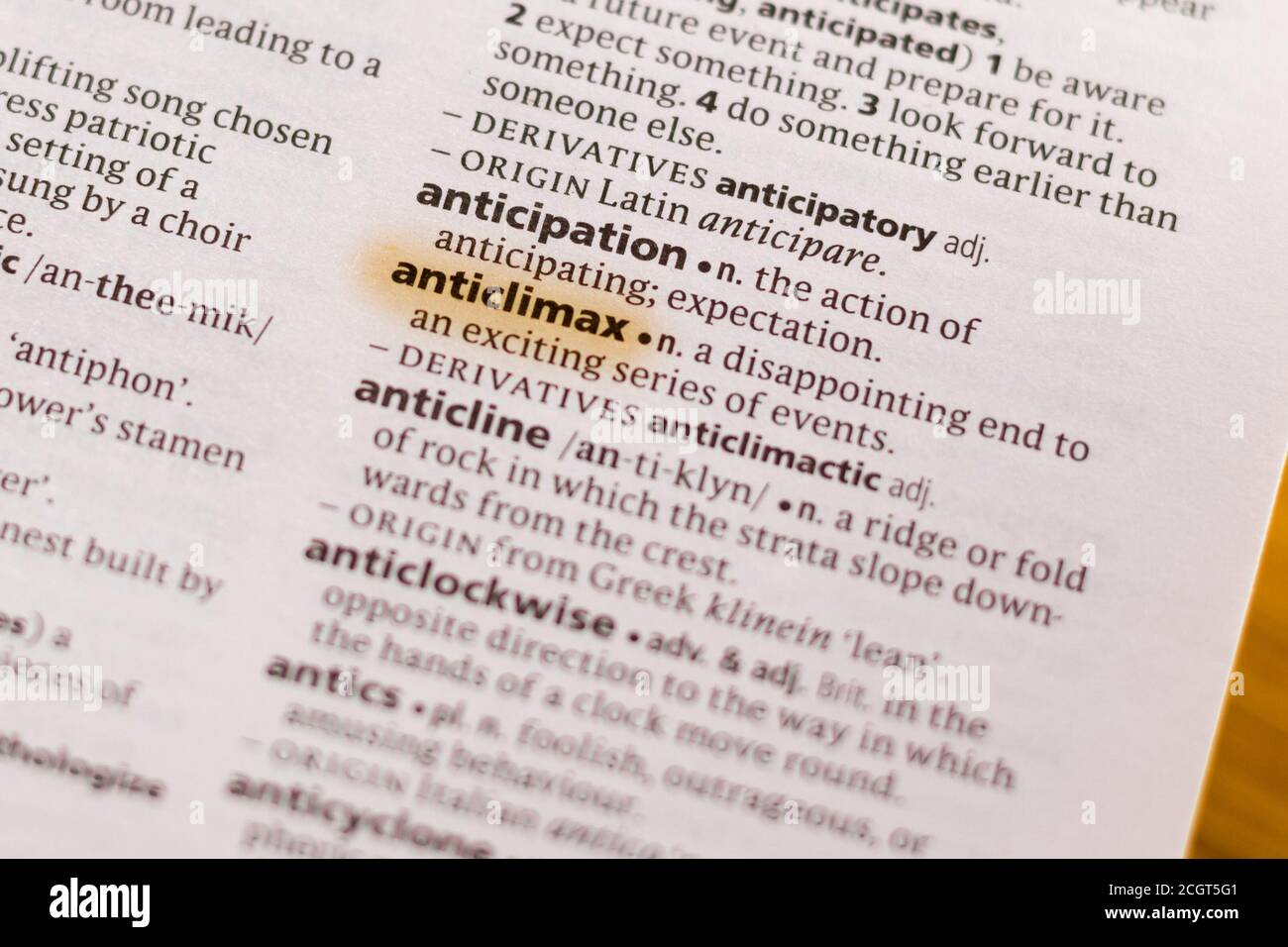 The word or phrase Anticlimax in a dictionary highlighted with marker. Stock Photo
