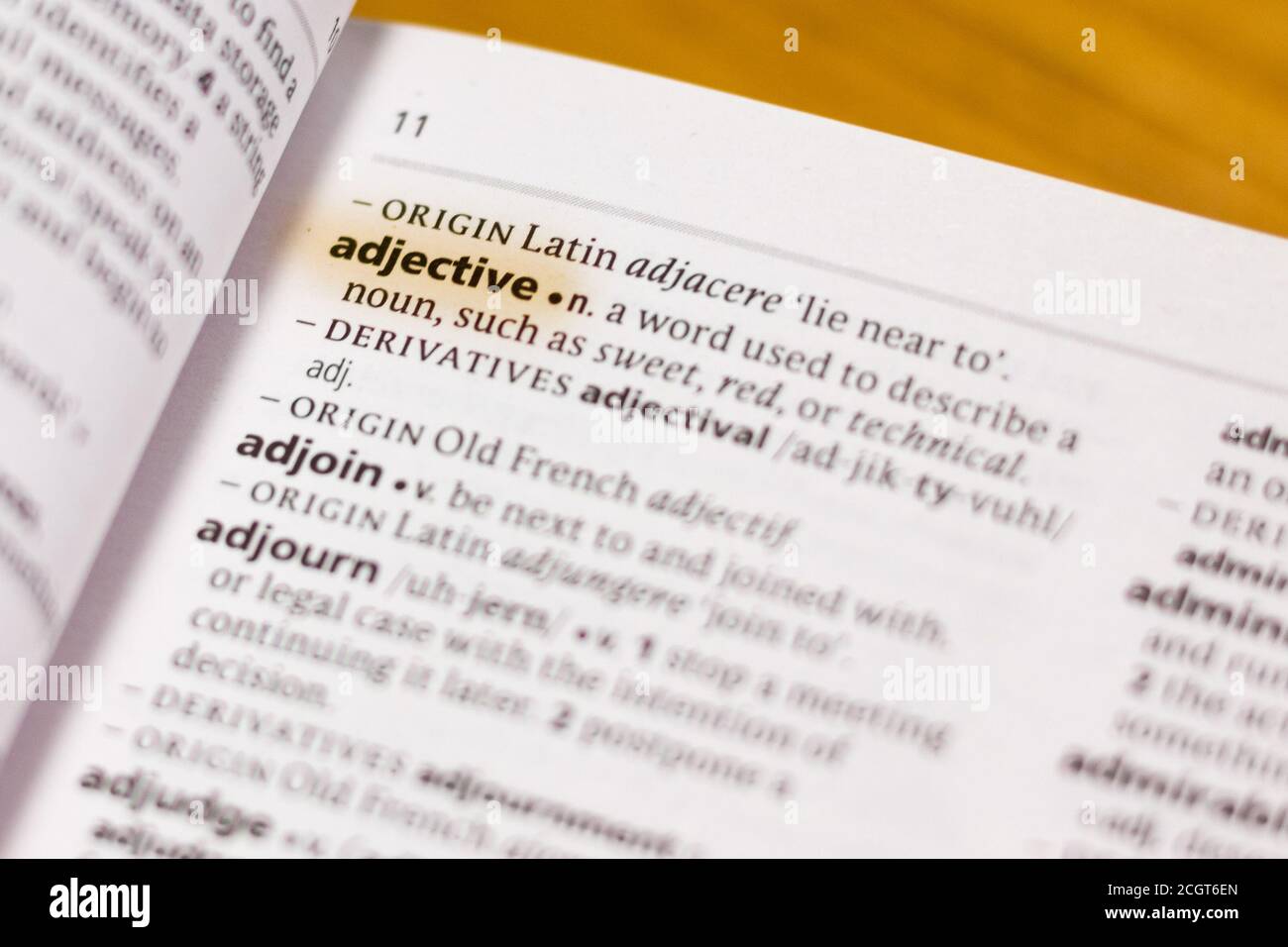 The word or phrase Adjective in a dictionary highlighted with marker